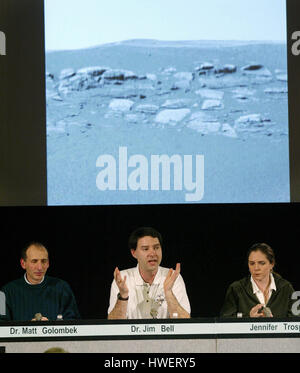 Jim Bell, a scientist from Cornell University, (C) describes new images transmitted from the Mars Rover Opportunity during a press conference at the Jet Propulsion Laboratory (JPL) in Pasadena, California on Wednesday 28 January 2004. Matt Golombek, (L) science team member ot the JPL, (L), and Jennifer Trosper, JPL mission manager are also shown. Photo by Francis Specker Stock Photo