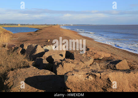 Shingle bay bar and lagoon formed by longshore drift, view north from Bawdsey to Shingle Street, Suffolk, England, UK Stock Photo