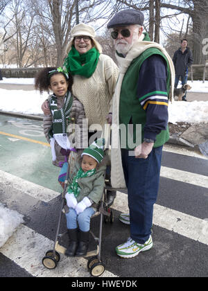 Family attend Saint Patrick's Day parade in the Park Slope neighborhood of Brooklyn, New York, 2017. Stock Photo