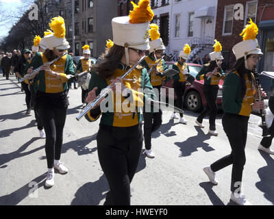 High school marching band performs at Saint Patrick's Day parade in the Park Slope neighborhood of Brooklyn, New York, 2017. Stock Photo