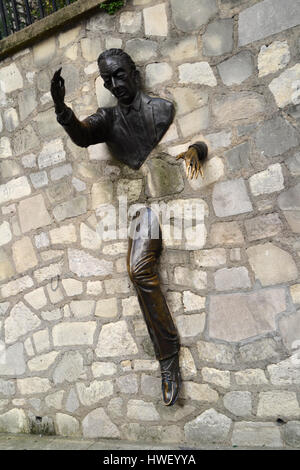 Sculpture called Le Passe-Muraille in Paris, France Stock Photo