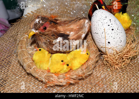 decorated egg with chick inside a wicker basket Stock Photo