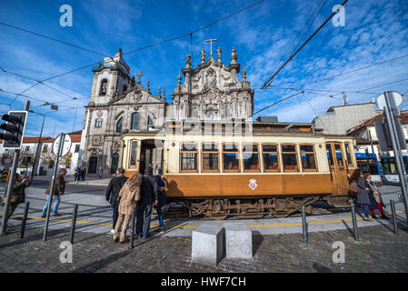 Vintage tram in front of Carmelite Church (Igreja dos Carmelitas Descalcos) and Carmo Church (Igreja do Carmo) in Vitoria parish of Porto, Portugal Stock Photo