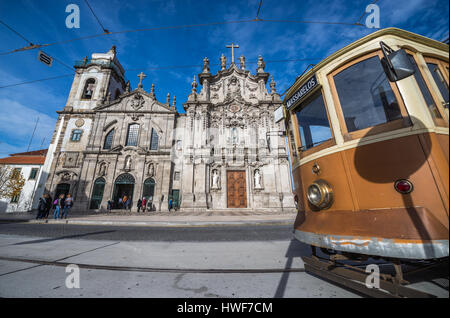 Vintage tram in front of Carmelite Church (Igreja dos Carmelitas Descalcos) and Carmo Church (Igreja do Carmo) in Vitoria parish of Porto, Portugal Stock Photo