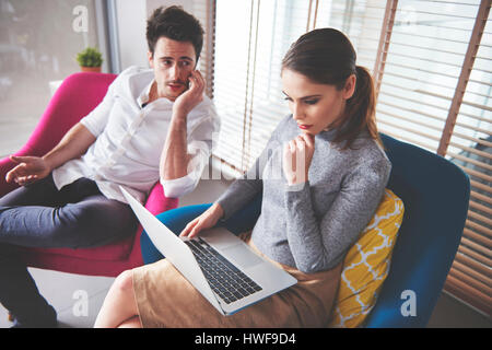 Top view of two pensive coworkes Stock Photo