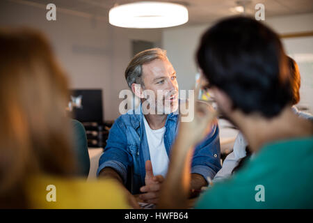 Man talking with his team in the office Stock Photo