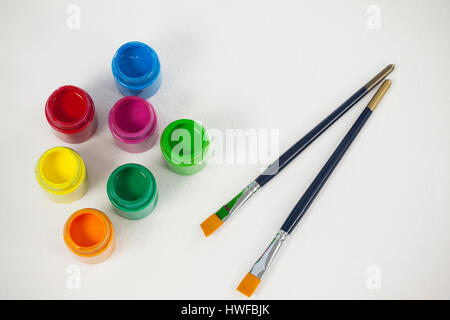 Paint brushes and watercolor paints against white background Stock ...