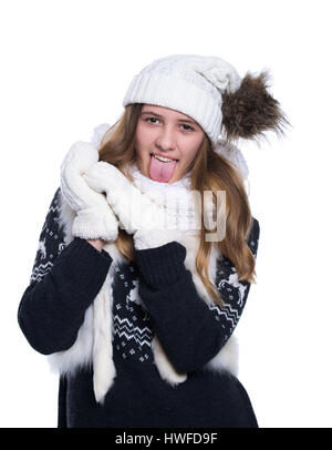 Cute cheerful teenage girl posing in the studio. Showing emotions. Wearing knitted woolen sweater, scarf, hat and mittens. Isolated on white backgroun Stock Photo