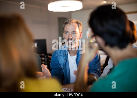 Man talking with his team in the office Stock Photo