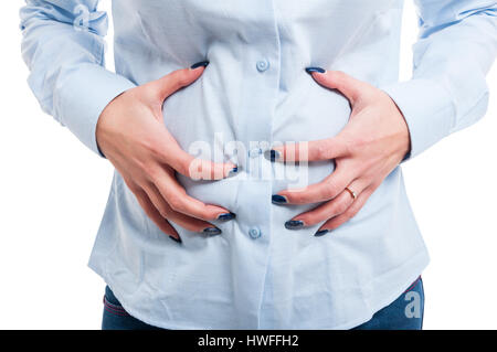 Close-up of woman architect holding her belly with both hands isolated on white background Stock Photo