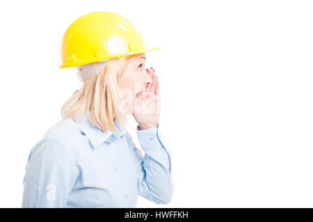 Side view female engineer making shouting or screaming gesture isolated on white background with copy text space Stock Photo