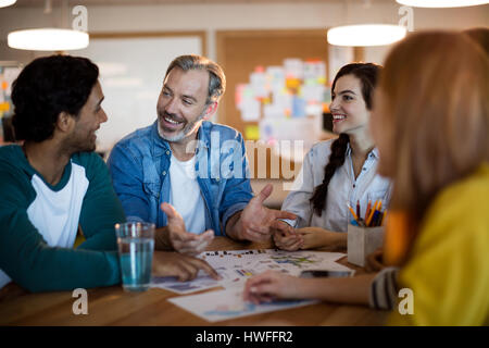 Creative business team discussing a plan in office Stock Photo