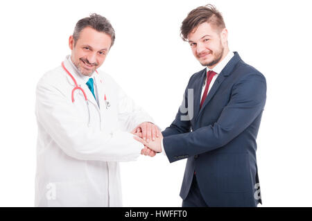 Handsome businessman and doctor are shaking their hands and smiling isolated on white background Stock Photo