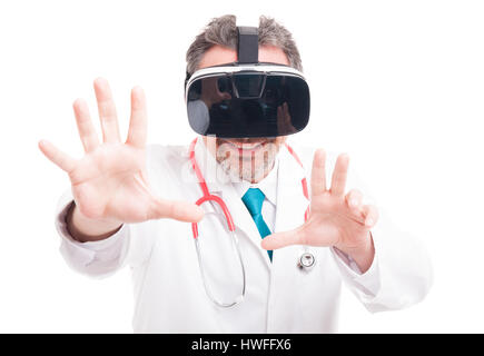 Male surgeon enjoy experiencing virtual reality and doing a catch gesture isolated on white Stock Photo