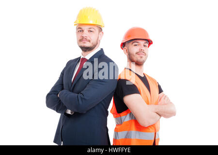 Proud or confident engineer and businessman posing back to back as successful partnership concept isolated on white Stock Photo