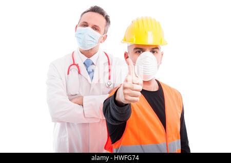 Trustworthy constructor and doctor showing thumb up being confident isolated on white background Stock Photo