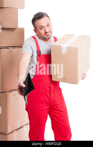 Mover guy holding box and showing his empty wallet looking sad isolated on white background Stock Photo