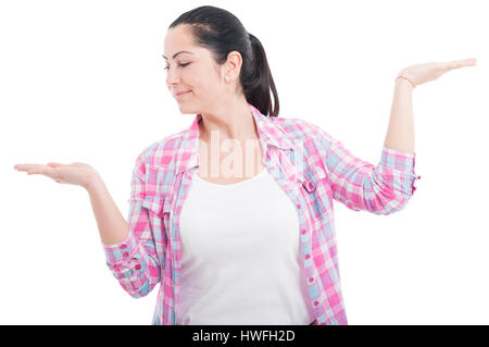 Gorgeous lady showing something invisible in her hands with advertising area isolated on white Stock Photo