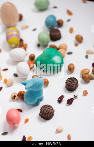 Easter rabbit, confetti, eggs, sweets, seeds, chocolates and props Stock Photo