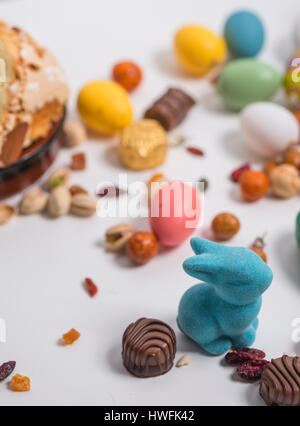 Easter rabbit, confetti, eggs, sweets, seeds, chocolates and props Stock Photo
