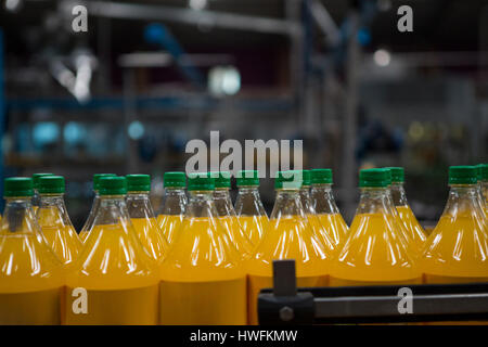 Download Glass Bottle Filled With Yellow Juice Stock Photo Alamy PSD Mockup Templates
