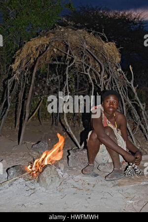 Hadzabe woman in front of her simple hut.  Lake Eyasi, northern Tanzania. Stock Photo