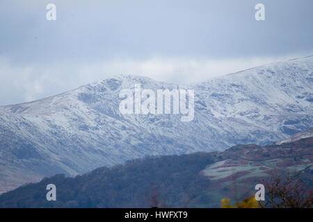 Cumbria, UK. 21st Mar, 2017. Overnight snow on the fells above Lake Windermere . Credit: Gordon Shoosmith/Alamy Live News Stock Photo