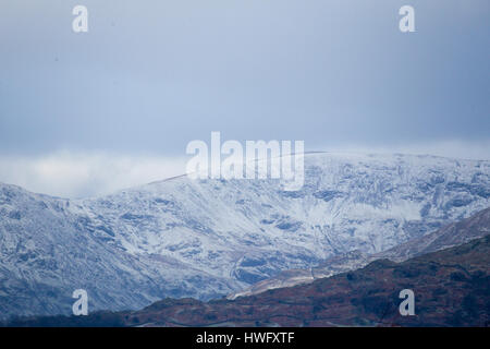 Cumbria, UK. 21st Mar, 2017. Overnight snow on the fells above Lake Windermere . Credit: Gordon Shoosmith/Alamy Live News Stock Photo