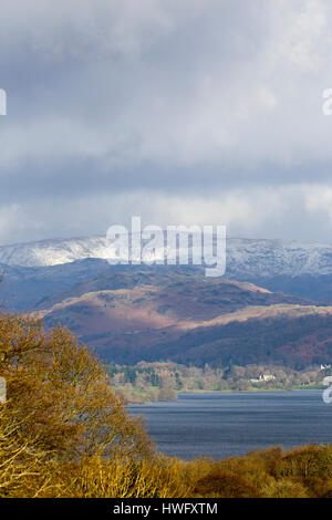 Cumbria, UK. 21st Mar, 2017. Overnight snow on the fells above Lake Windermere . Credit: Gordon Shoosmith/Alamy Live News Stock Photo