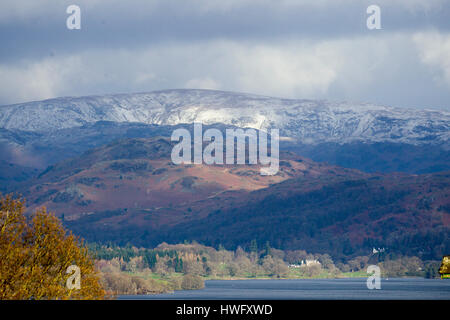 Cumbria, UK. 21st Mar, 2017. Overnight snow on the fells above Lake Windermere . Credit: Gordon Shoosmith/Alamy Live News Stock Photo