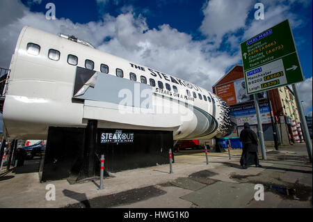 Bolton, UK. 21st Mar, 2017. A unique new restaurant in a former Russian jet has just 'landed' in Bolton. The Steak Out, Steaks on a Plane diner, built inside a Boeing 737 aircraft on Deane Road in the town, offers diners a custom built interior featuring led lights to replicate the night sky plus murals of cities around the world. Foodies can also fasten their seat belts in the cockpit as they await their orders. The plane parked on its 'runway'. Picture by Paul Heyes, Tuesday March 21, 2017. Credit: Paul Heyes/Alamy Live News Stock Photo