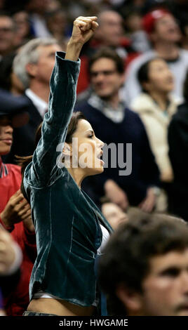 Actress Eva Longoria pumps her fist while cheering for the San Antonio Spurs Tony Parker during a Los Angeles Lakers NBA basketball game in Los Angeles on Monday, March 6, 2006. Photo by Francis Specker Stock Photo