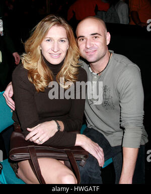 Andre Agassi, right, with his wife, Steffi Graf during Ultimate Fighting Champion Championship UFC 66 at the MGM Grand Garden Arena in Las Vegas on December 30, 2006. Photo credit: Francis Specker Stock Photo