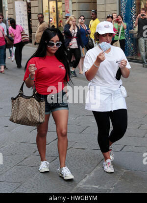Nicole 'Snooki' Polizzi , red shirt, and Deena Nicole Cortese walk to work during season 4 of MTV's 'Jersey Shore' in Florence, Itlay on May 23, 2011. Photo by Francis Specker Stock Photo