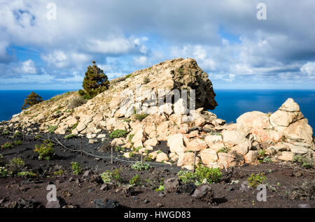 Cumbre Vieja, Fuencaliente. La Palma.  Ancient rocks of the island that were buried in lava until recently rediscovered.  This rock bears engravings from the island's original indigenous people dating back before the last eruption of San Antonio in 1677 when it was buried under lava rock. Stock Photo