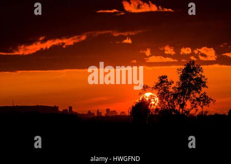 orange sunset over a city Stock Photo