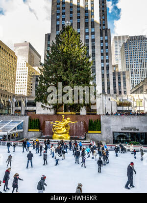 People ice skating in front of Rockefeller Center Christmas Tree - New York, USA Stock Photo