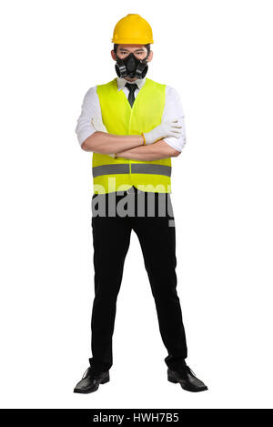 Asian worker wearing safety vest and yellow helmet isolated over white background Stock Photo