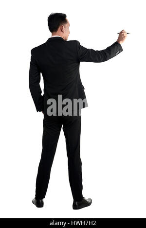 Asian business man writing something isolated over white background Stock Photo