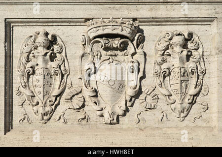 SPQR symbol of Ancient Roman Republic with other old noble emblems on Capitol Hill monumental staircase in Rome Stock Photo