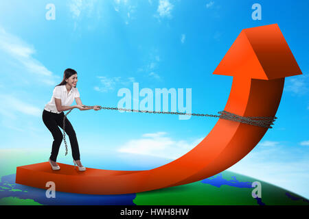 Asian business woman pulling chain isolated over white background Stock ...