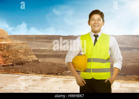 Asian engineer wearing safety vest. Industrial concept Stock Photo