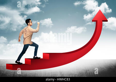 Conceptual Image. Business man step on stair with red arrow shape going up Stock Photo