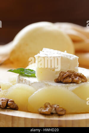 Organic camembert cheese with nuts and pears Stock Photo