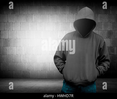 Computer hacker silhouette of hooded man. Threat of your security Stock Photo