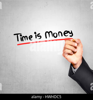 Man writing with pen time is money text over grunge background Stock Photo