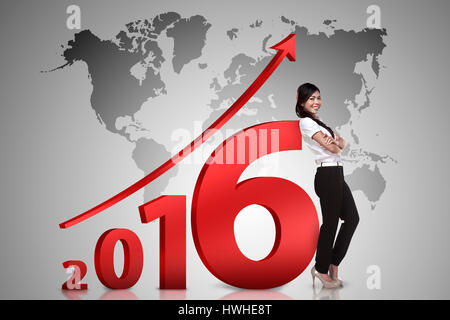 Asian business person lean next to 2016 number. New year resolution concept Stock Photo