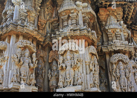 Deity sculpture under eves on shrine outer wall in the Chennakesava Temple, Hoysala Architecture, Somanathpur, Karnataka, India Stock Photo