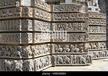 Shrine wall relief sculpture follows a stellate plan, depicting Swans, makara(imaginary beast), Hindu puranas, foliage, horsemen and elephants Stock Photo