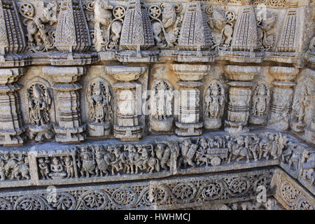 Close up of stone carvings, of deities, sculptures include of depictions of affluence of that age including members of the royal family riding richly  Stock Photo